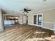 Living room with hardwood floors and access to both kitchen and sunroom at 3210 Woolbridge Ln, Marietta, GA 30062