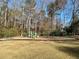 Community playground with swings and playset at 3210 Woolbridge Ln, Marietta, GA 30062