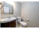 Simple bathroom with single vanity, toilet, and neutral-toned walls at 3480 Park Bluff Ln, Duluth, GA 30096