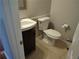 Small bathroom with pedestal sink, toilet, and tile floor at 3480 Park Bluff Ln, Duluth, GA 30096