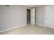 Bedroom with tile flooring, neutral paint, and two doors at 3480 Park Bluff Ln, Duluth, GA 30096