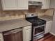 Kitchen with stainless steel appliances and granite countertops at 3480 Park Bluff Ln, Duluth, GA 30096