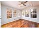 Sunroom with large windows and hardwood floors at 3480 Park Bluff Ln, Duluth, GA 30096