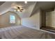 Large bonus room with vaulted ceilings and carpeted floors at 6615 Callanwalde Ct, Suwanee, GA 30024