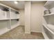 Large walk-in closet with ample shelving and hanging space at 6615 Callanwalde Ct, Suwanee, GA 30024