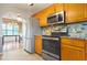 Kitchen with stainless steel appliances and granite countertops at 310 Butler Bridge Cir, Covington, GA 30016