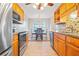 Kitchen with granite countertops, stainless steel appliances, and wood cabinets at 310 Butler Bridge Cir, Covington, GA 30016