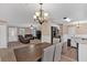 Open concept living room with a view into the kitchen and dining area at 733 Brandlwood Nw Way, Lilburn, GA 30047