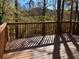 Wooden deck overlooking a wooded area with a view of nature at 1870 Fairpointe Trce, Stone Mountain, GA 30088