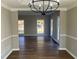 Spacious dining room featuring hardwood floors and a modern chandelier at 1870 Fairpointe Trce, Stone Mountain, GA 30088