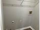 Laundry room with washer and dryer hookups and shelving at 1870 Fairpointe Trce, Stone Mountain, GA 30088