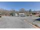 Gravel lot with various vehicles and equipment at 1793 Johnson Road, Cumming, GA 30040