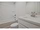 Clean bathroom with a bathtub, toilet and modern vanity at 913 Agate Ln, Lawrenceville, GA 30043