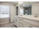 Modern bathroom with double vanity and a large mirror at 913 Agate Ln, Lawrenceville, GA 30043