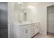 Elegant bathroom boasting double vanity and ample storage at 913 Agate Ln, Lawrenceville, GA 30043