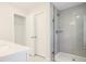 Modern bathroom with a walk-in shower and white cabinetry at 913 Agate Ln, Lawrenceville, GA 30043
