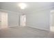 Bright bedroom featuring carpet floors and ample closet space at 913 Agate Ln, Lawrenceville, GA 30043