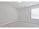 Bright bedroom featuring neutral walls and carpet flooring at 913 Agate Ln, Lawrenceville, GA 30043