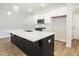 Open kitchen with large island and ample counter space at 913 Agate Ln, Lawrenceville, GA 30043