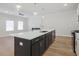 Spacious kitchen island with seating and a built-in sink at 913 Agate Ln, Lawrenceville, GA 30043