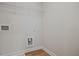 Bright laundry room with built-in shelving and hookups at 913 Agate Ln, Lawrenceville, GA 30043