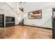 Living room with built-in entertainment center, hardwood floors, and open loft at 1473 Ragley Hall Ne Rd, Brookhaven, GA 30319