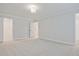 Bright bedroom with gray carpet and neutral walls at 907 Agate Ln, Lawrenceville, GA 30043