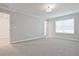 Spacious bedroom with gray carpet and neutral walls at 907 Agate Ln, Lawrenceville, GA 30043