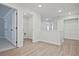 Upstairs hallway with access to bedrooms, laundry, and closets at 907 Agate Ln, Lawrenceville, GA 30043