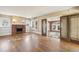 Living room with hardwood floors, fireplace, and access to sunroom at 1380 Emory Ne Rd, Atlanta, GA 30306