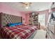 Spacious bedroom with large bed, window, and ample closet space at 3547 Valley Bluff Ln, Snellville, GA 30039