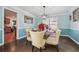 Formal dining room with light beige chairs and a glass-top table at 3547 Valley Bluff Ln, Snellville, GA 30039
