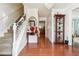 Bright entryway with hardwood floors, staircase, and decorative accents at 3547 Valley Bluff Ln, Snellville, GA 30039