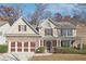 Two-story house with stone accents and a brown-trimmed garage at 3547 Valley Bluff Ln, Snellville, GA 30039