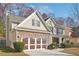 Two-story house with stone accents and a brown-trimmed garage at 3547 Valley Bluff Ln, Snellville, GA 30039