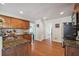 Kitchen features granite countertops, wood cabinets, and hardwood floors at 3547 Valley Bluff Ln, Snellville, GA 30039