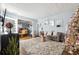 Spacious living room with gray sofa, large rug, and Christmas tree at 3547 Valley Bluff Ln, Snellville, GA 30039