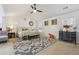 Bright main bedroom with large bed and sitting area at 3547 Valley Bluff Ln, Snellville, GA 30039