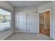 Bedroom with carpeted floors, window, and access to closets at 2908 Rambler Dr, Loganville, GA 30052