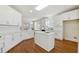 Modern kitchen with white cabinets, quartz countertops, and an island at 295 Cherington Ln, Lawrenceville, GA 30044