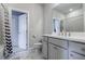 Modern bathroom with gray vanity and shower at 4030 River Rapids Dr, Roswell, GA 30076