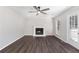 Bright living room with fireplace, hardwood floors, and sliding glass doors at 508 Sutters Mill Rd, Stone Mountain, GA 30087