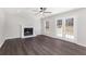 Living room with fireplace, hardwood floors and doors to deck at 508 Sutters Mill Rd, Stone Mountain, GA 30087