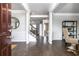 Bright entryway with hardwood floors, leading to staircase and open living area at 327 Collier Mill Rd, Lawrenceville, GA 30045