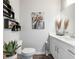 Modern bathroom with white cabinets and a frameless glass shower at 472 Eagles Nest Cir, Auburn, GA 30011