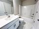 Clean bathroom with white vanity, bathtub, and marble tile floor at 5465 Rock Place Ct # 41, Norcross, GA 30093