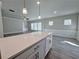 White kitchen island with a view into the living room at 5465 Rock Place Ct # 41, Norcross, GA 30093