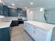 Modern kitchen with dark blue cabinets and white countertops at 5465 Rock Place Ct # 41, Norcross, GA 30093