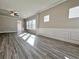 Bright living room featuring hardwood floors and wainscoting at 5465 Rock Place Ct # 41, Norcross, GA 30093