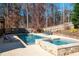 Stunning pool and spa surrounded by a large patio at 355 Clark Creek Pass, Acworth, GA 30102